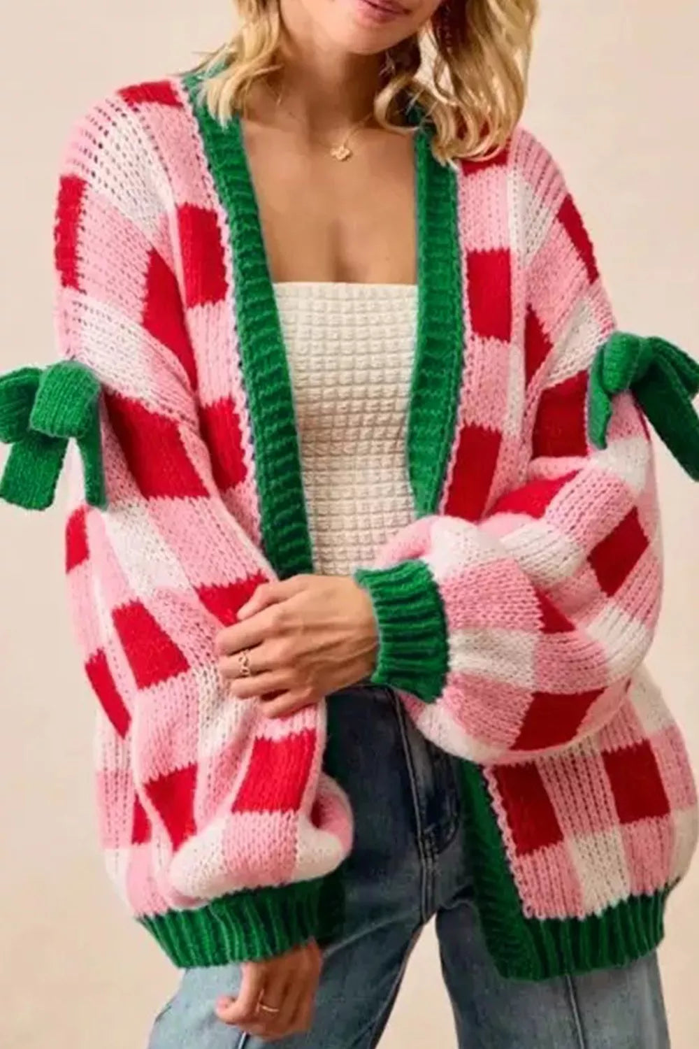 Checkered bow-tie sleeve knit Christmas cardigan by Tikibella™, featuring festive patterns and cozy knit design.