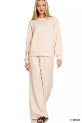 Zenana Tikibella™ scuba crewneck pullover and matching pants set in a cozy, relaxed fit with a smooth texture.