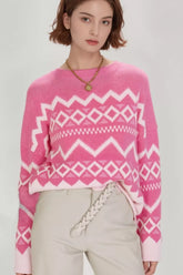 Geometric patterned long sleeve sweater by Tikibella™, featuring vibrant colors and a cozy knit design.