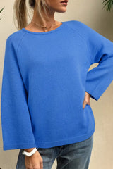 Solid color knit dolman sweater with loose bracelet sleeves by Tikibella™, displayed on a neutral background.