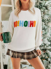 Drop shoulder holiday sweater with a "HOHOHO MERRY CHRISTMAS" design by Tikibella™, featuring festive colors and cozy knit.