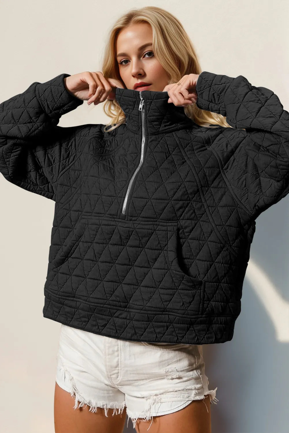 Tikibella™ Double Take half zip long sleeve quilted sweatshirt featuring a front pocket and textured fabric design.