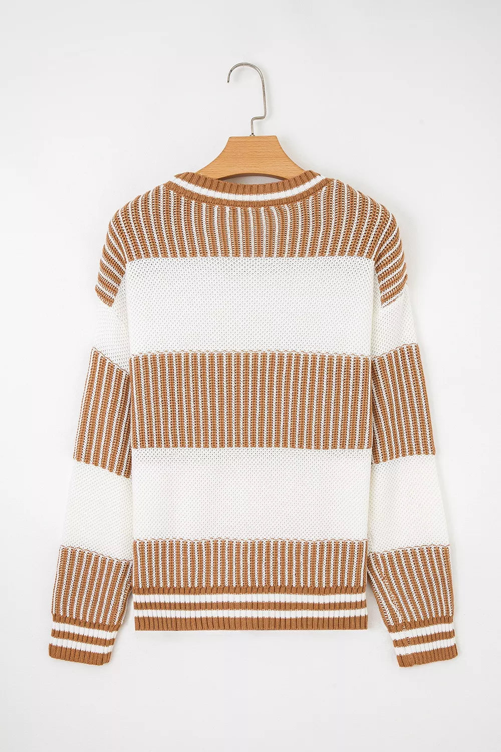 Striped knit long sleeve sweater by Tikibella™, featuring a cozy design and vibrant color patterns.