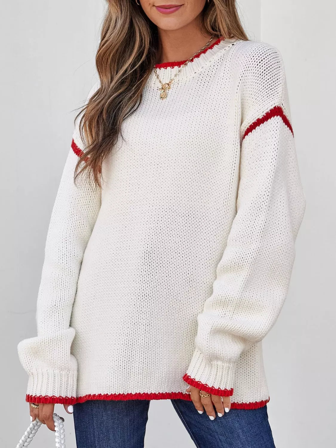 Contrast trim round neck sweater by Tikibella™ featuring a stylish design and soft fabric in a casual setting.