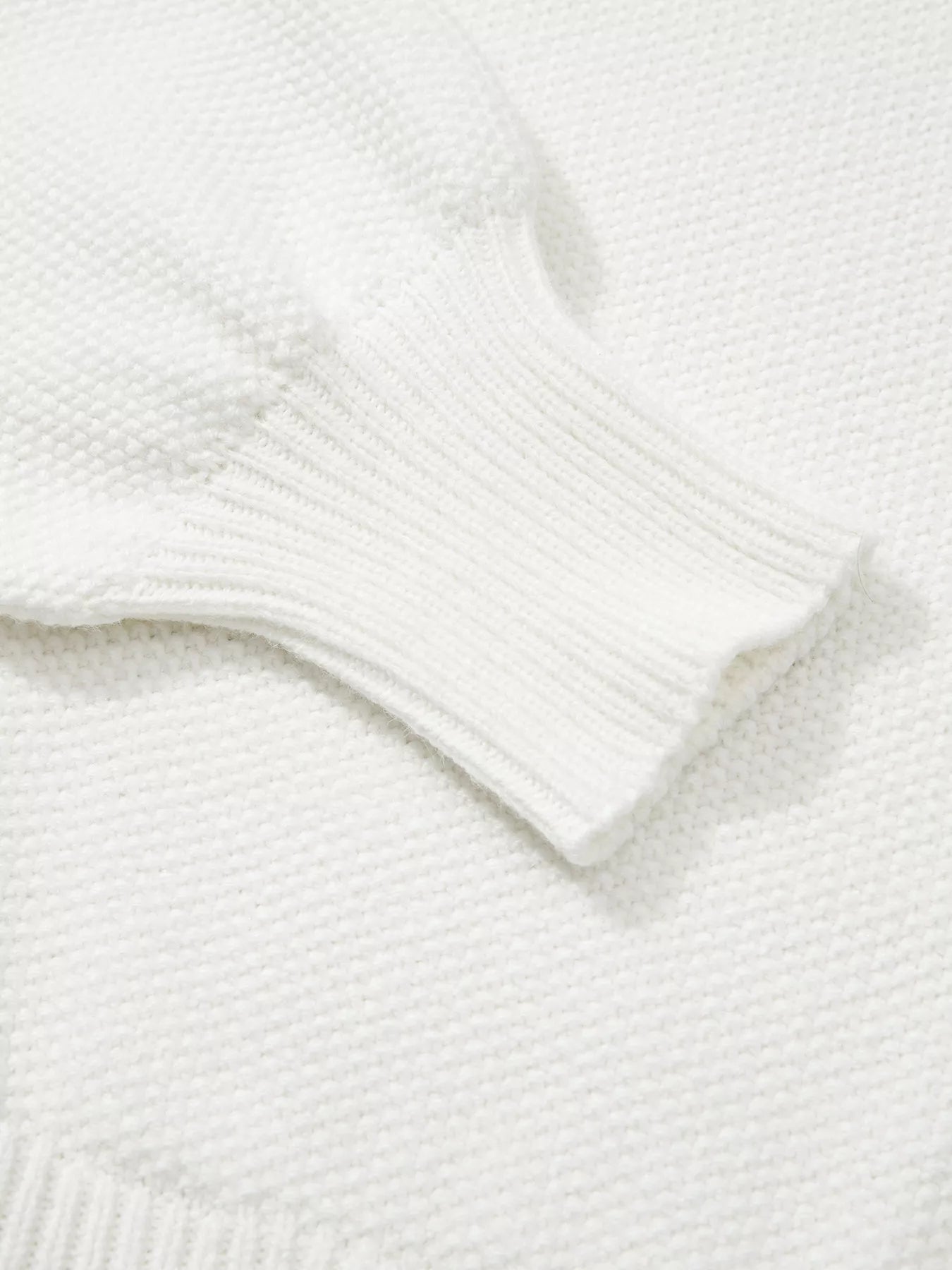 Tikibella™ HOHOHO MERRY CHRISTMAS drop shoulder holiday sweater in festive red with green lettering.