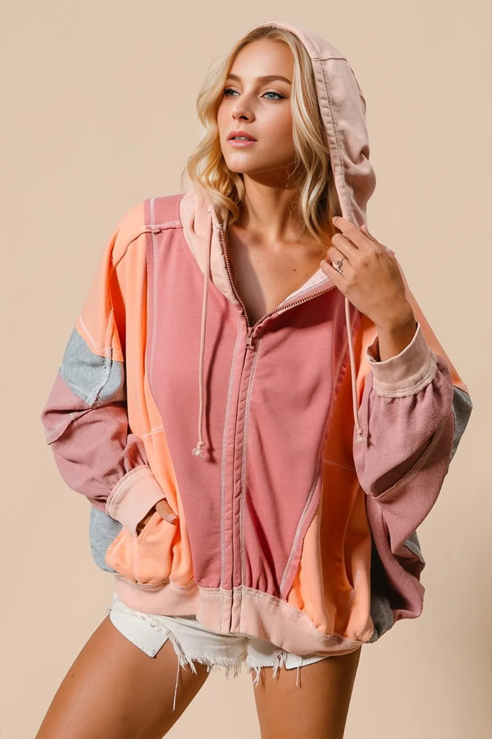 Tikibella™ Double Take Color Block Zip Up Hoodie featuring vibrant colors and a stylish design.