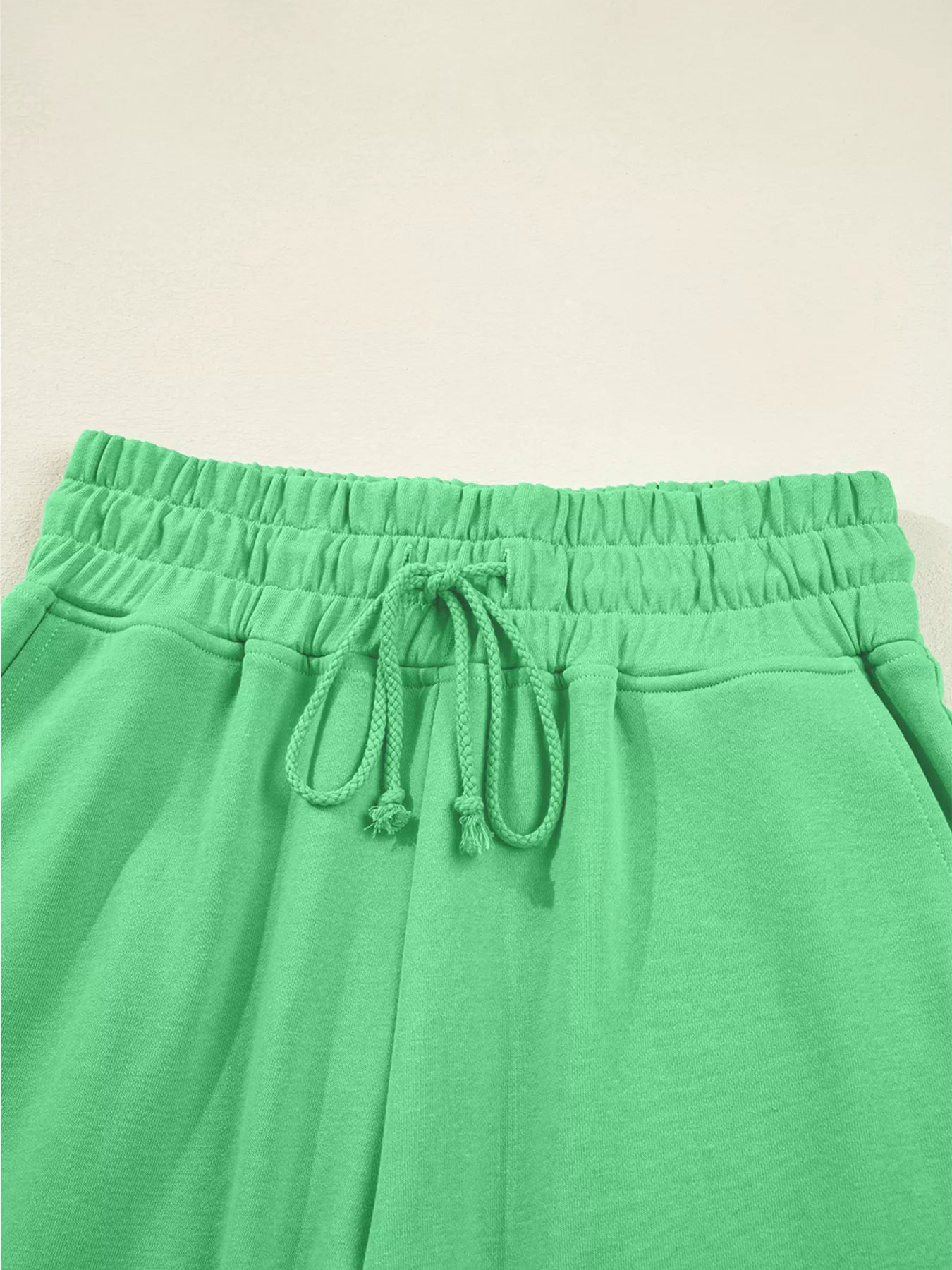 Tikibella™ drop shoulder puff sleeve crop top paired with drawstring wide leg pants in a stylish set.