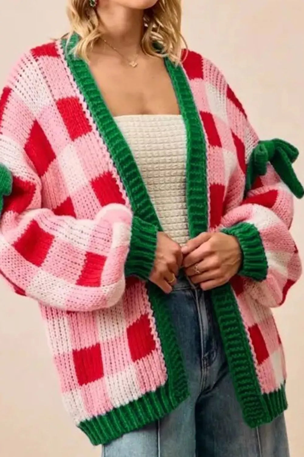 Checkered bow-tie sleeve knit Christmas cardigan by Tikibella™, featuring festive patterns and a cozy design.