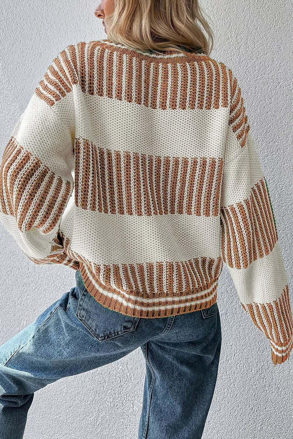 Tikibella™ striped knit long sleeve sweater featuring a cozy design and vibrant colors, ideal for casual wear.