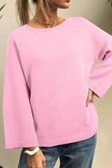 Solid color knit dolman sweater with loose bracelet sleeves by Tikibella™, displayed on a neutral background.