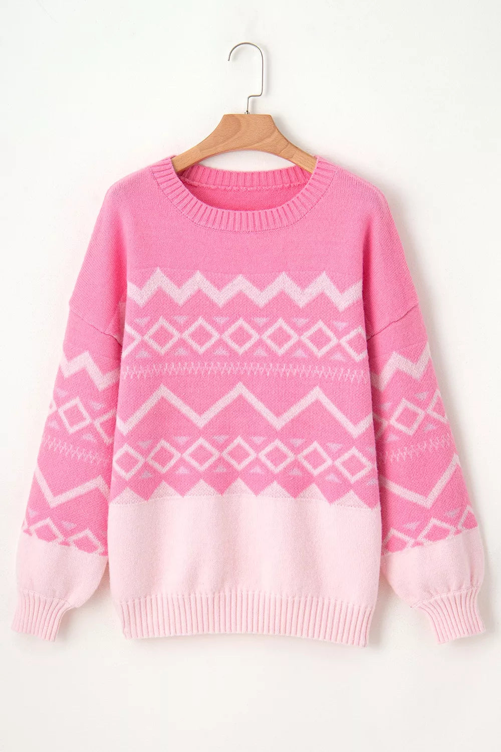 Geometric patterned long sleeve sweater by Tikibella™, featuring a stylish design in soft fabric.