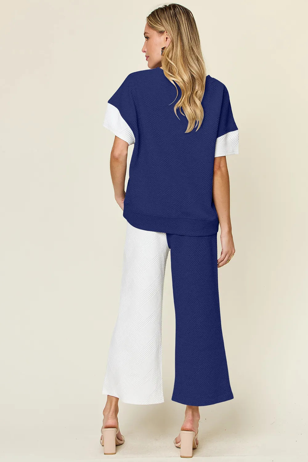 Tikibella™ Double Take texture contrast t-shirt paired with wide leg pants, showcasing a stylish casual outfit set.