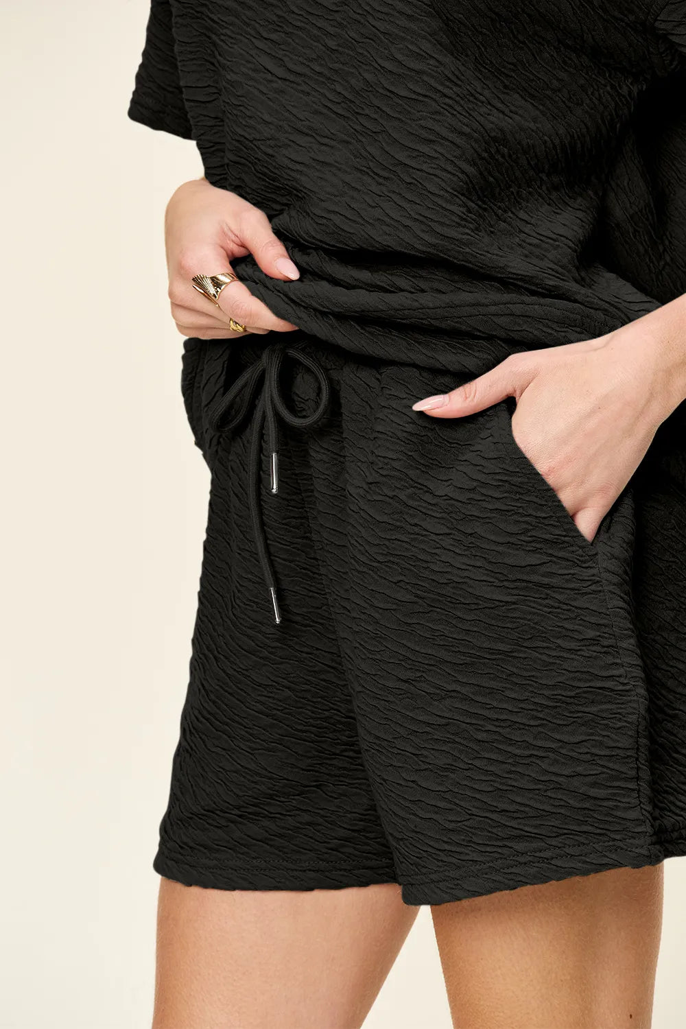 Double Take Tikibella™ short sleeve t-shirt and drawstring shorts set in a casual, relaxed fit.