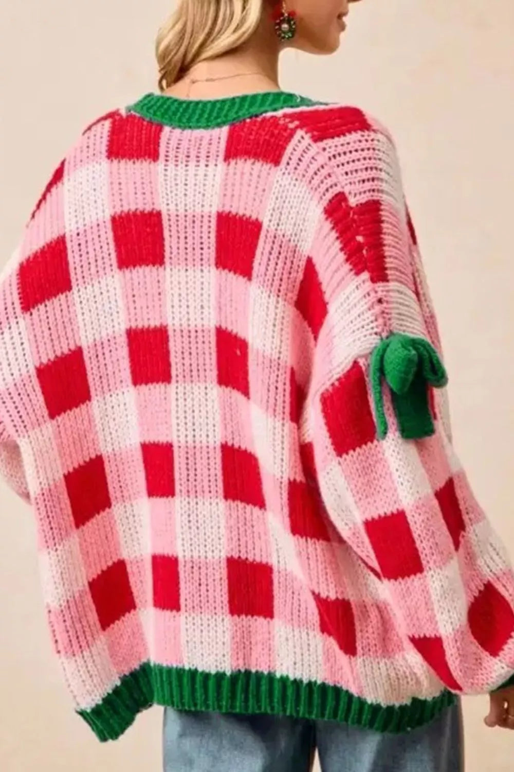Checkered bow-tie sleeve knit Christmas cardigan by Tikibella™, featuring festive patterns and a cozy fit.