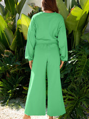 Drop shoulder puff sleeve crop top paired with drawstring wide leg pants set from Tikibella™, displayed on a mannequin.