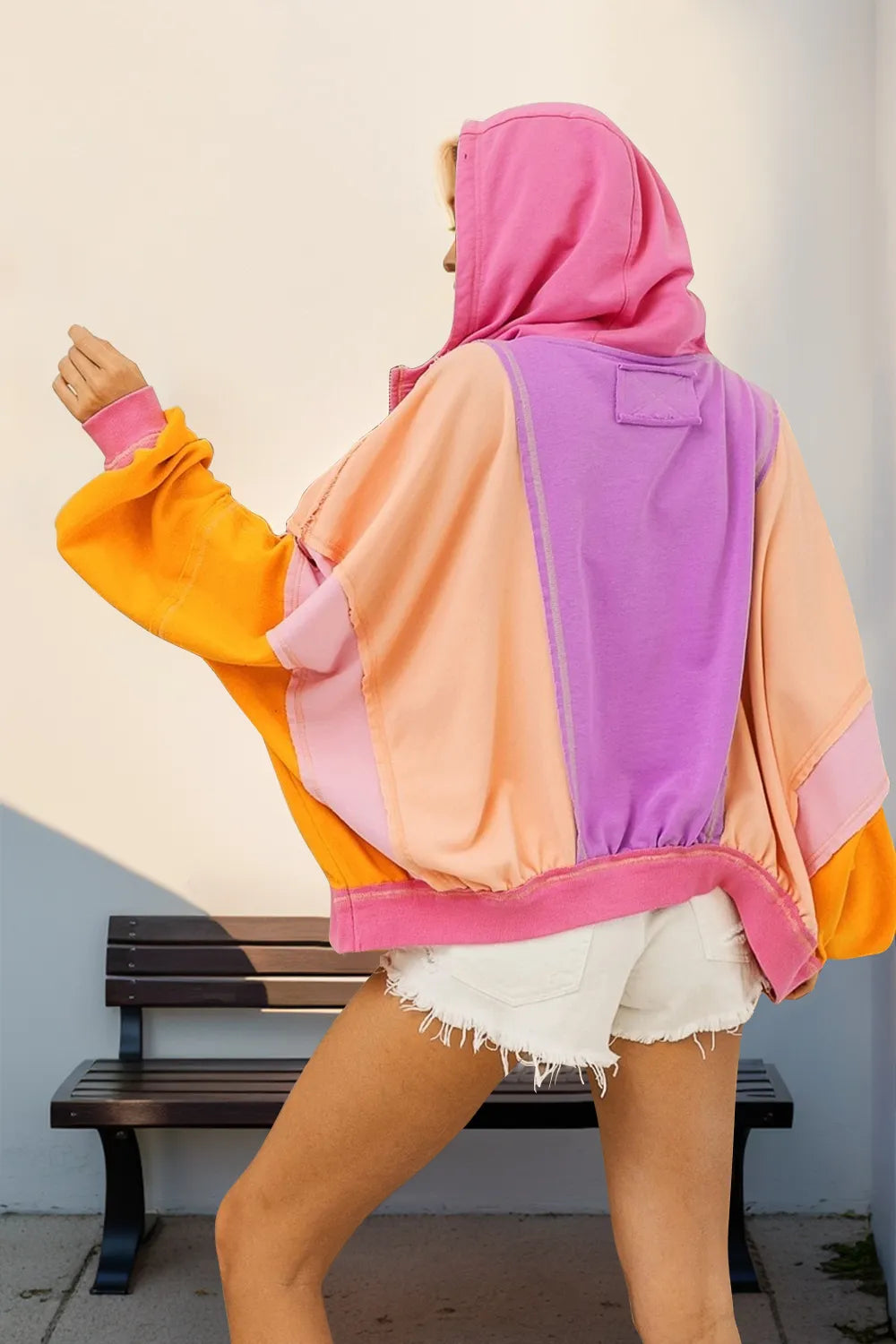 Tikibella™ color block zip up hoodie featuring a full-size design with contrasting colors and a front zipper.