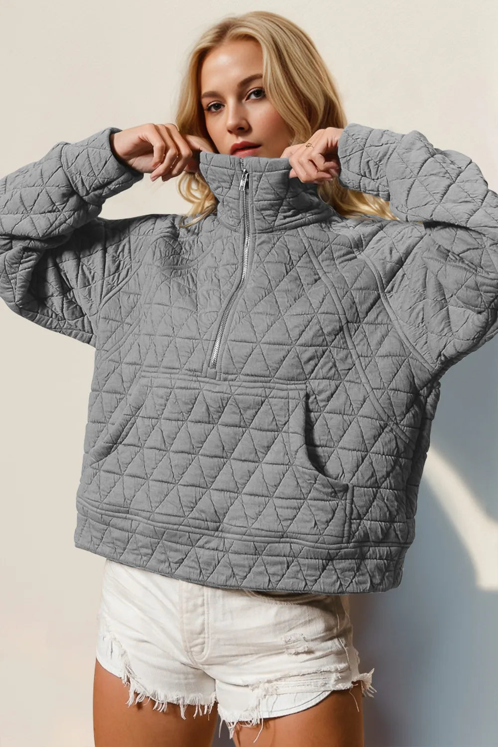 Tikibella™ double take half zip long sleeve quilted sweatshirt with pocket in a stylish design and comfortable fit.