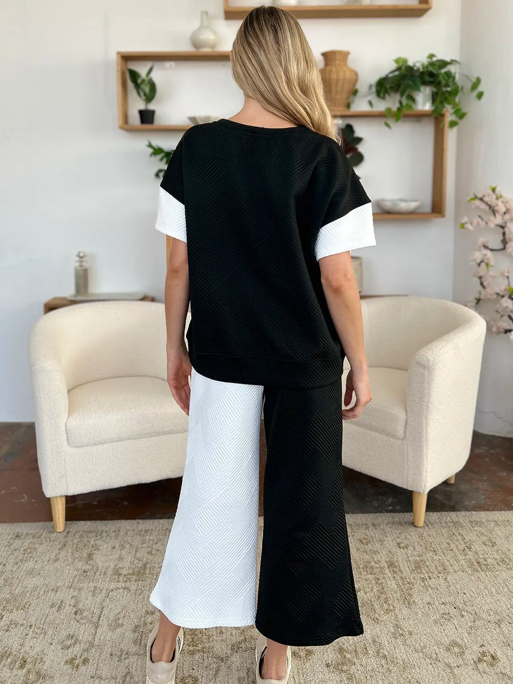 Tikibella™ double take full size texture contrast t-shirt paired with wide leg pants set in a stylish outfit display.
