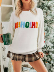 Drop shoulder holiday sweater with a "HOHOHO MERRY CHRISTMAS" design by Tikibella™, featuring festive colors and cozy knit.