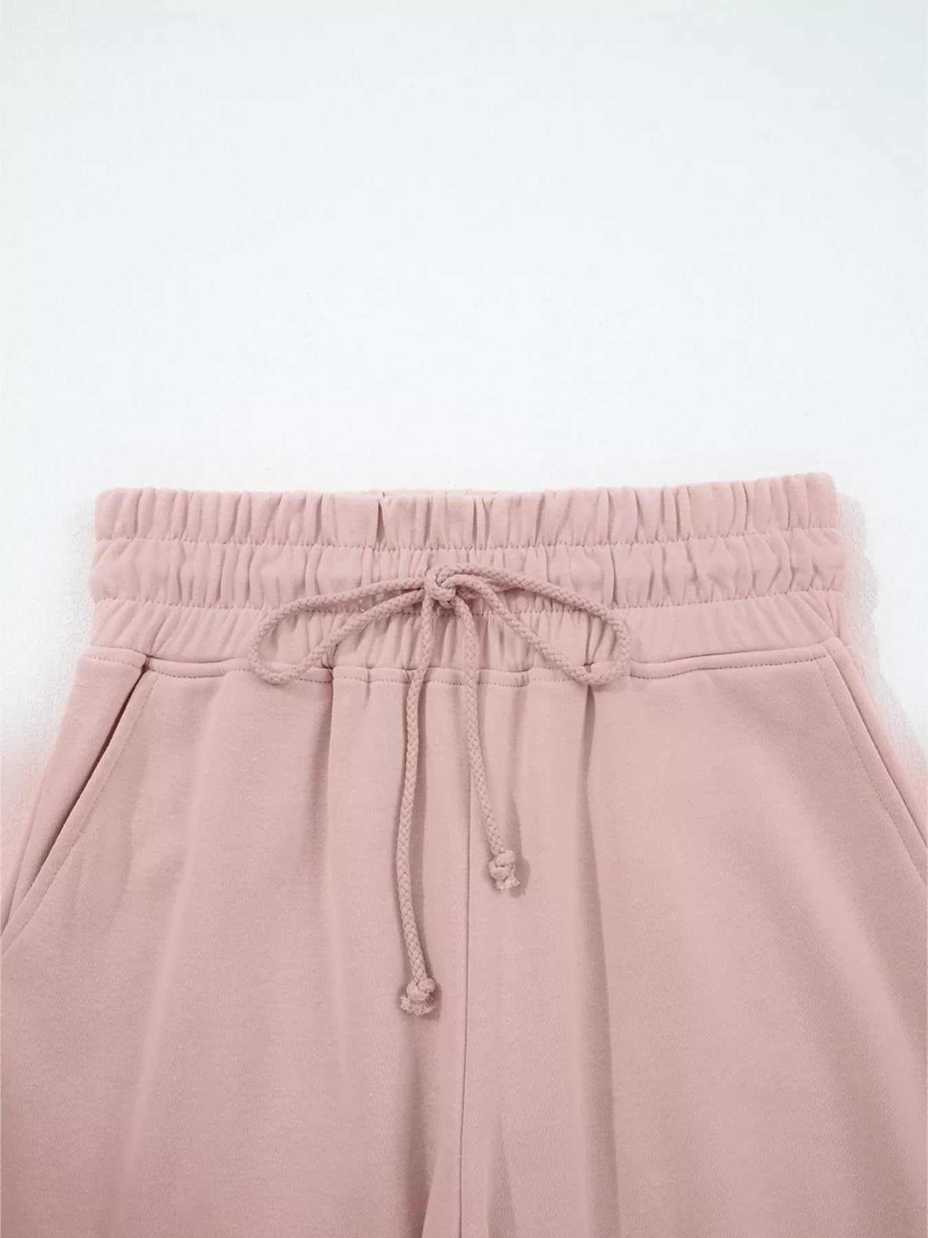 Tikibella™ drop shoulder puff sleeve crop top paired with drawstring wide leg pants in a stylish set.