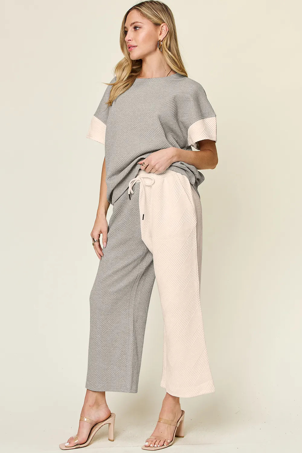 Tikibella™ Double Take T-Shirt and wide leg pants set featuring a textured contrast design in a stylish casual outfit.