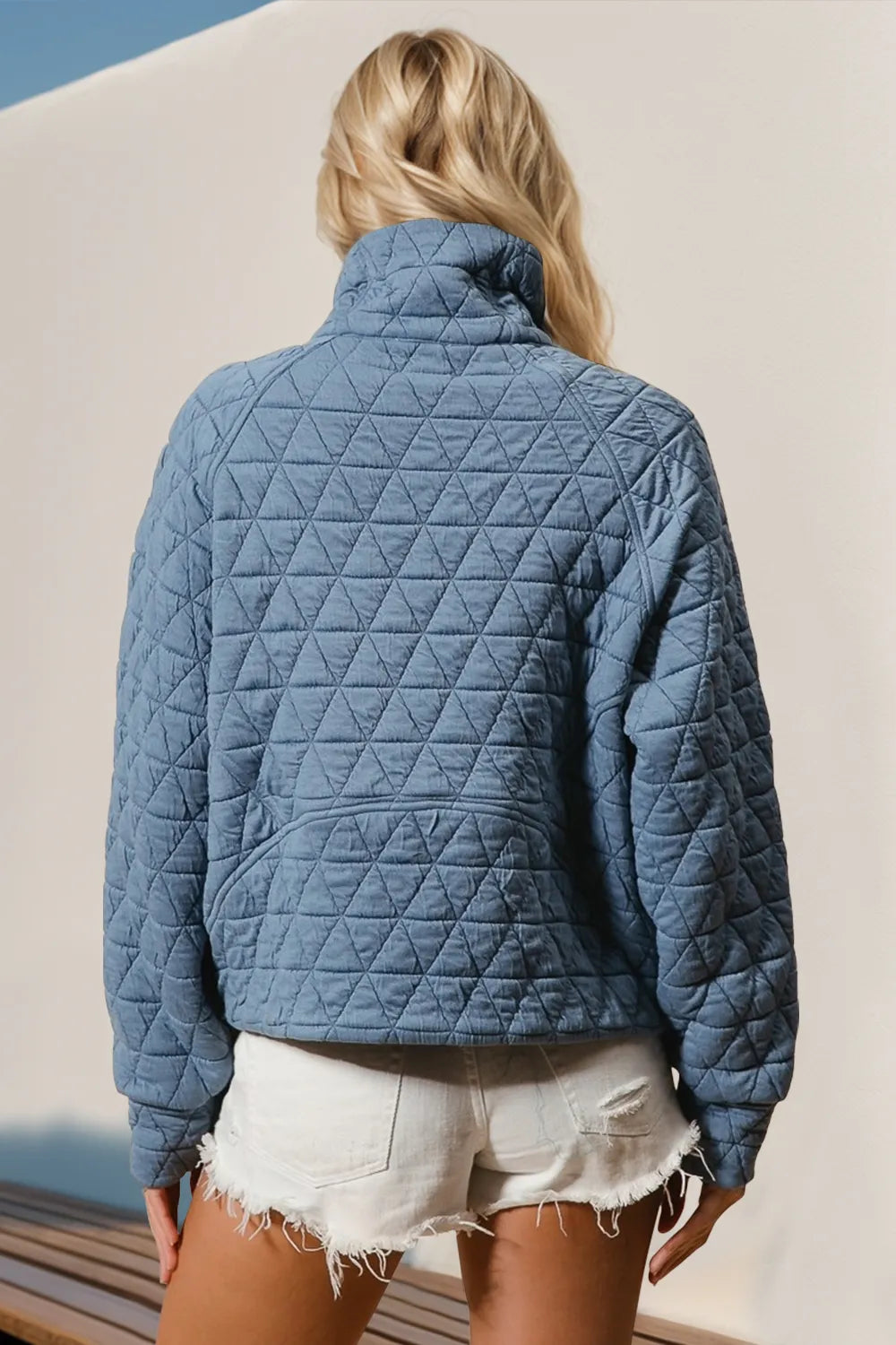 Tikibella™ Double Take half zip long sleeve quilted sweatshirt with pocket in a cozy, casual style.
