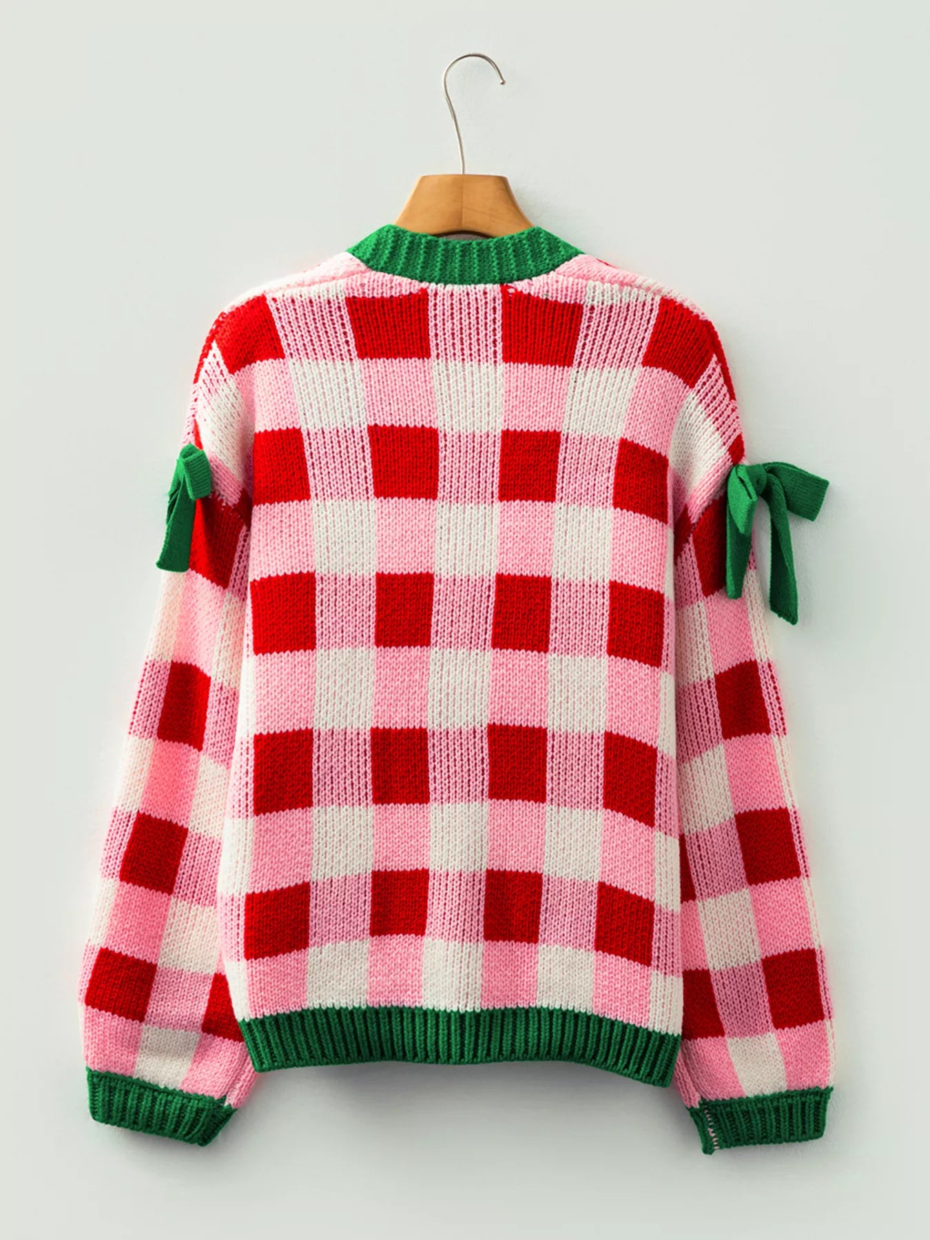 Checkered bow-tie sleeve knit Christmas cardigan by Tikibella™ in festive holiday colors.