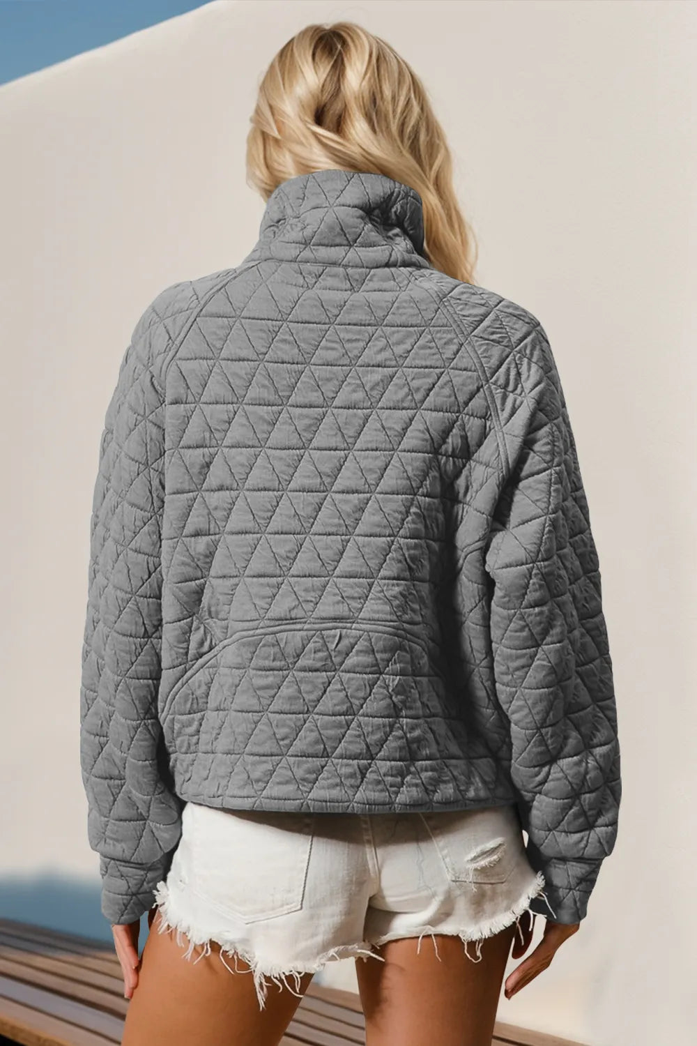 Tikibella™ double take half zip long sleeve quilted sweatshirt with pocket in a cozy, casual style.