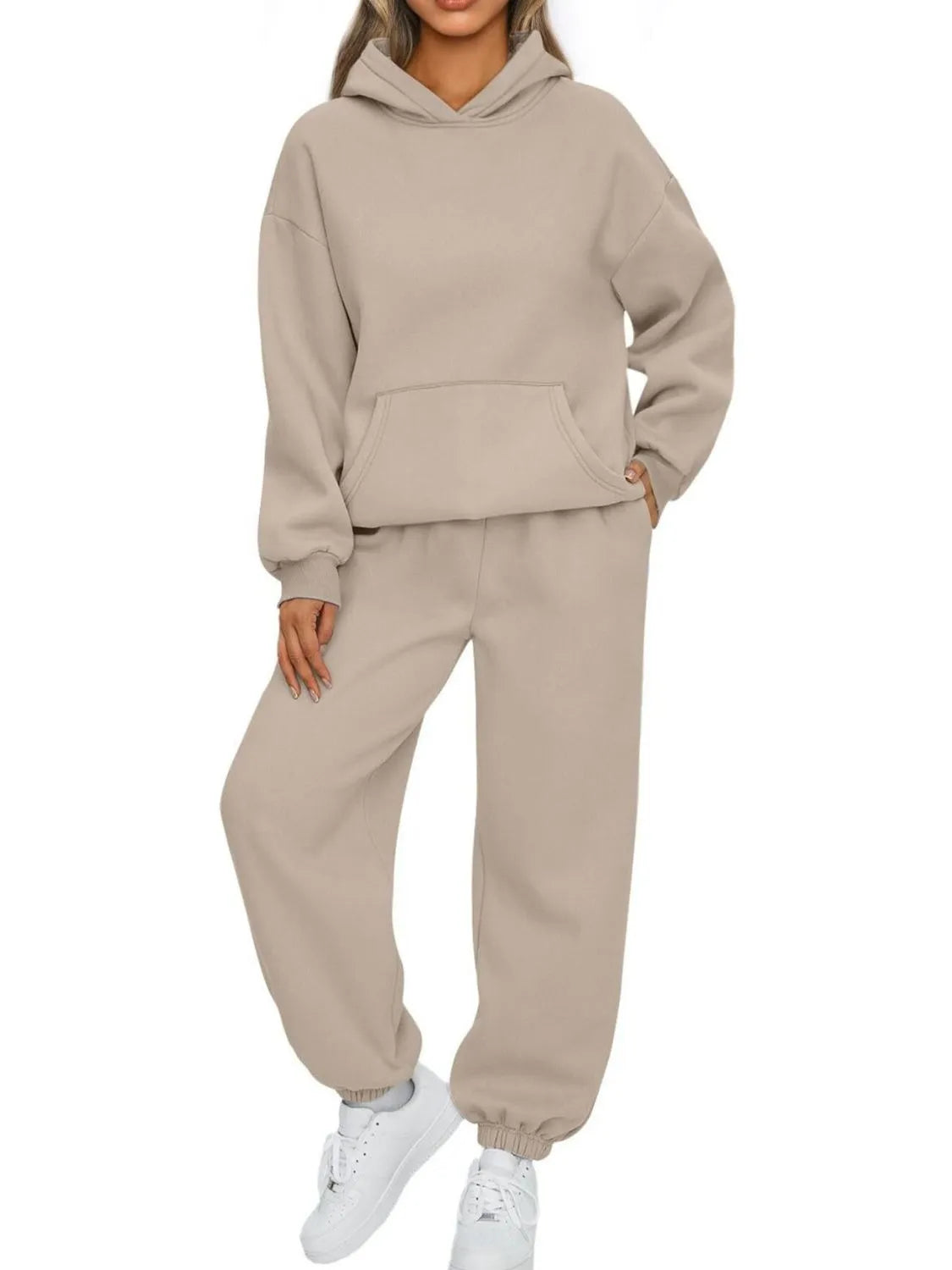 Plus size Tikibella™ hoodie and joggers set with a kangaroo pocket, displayed in a casual outfit setting.